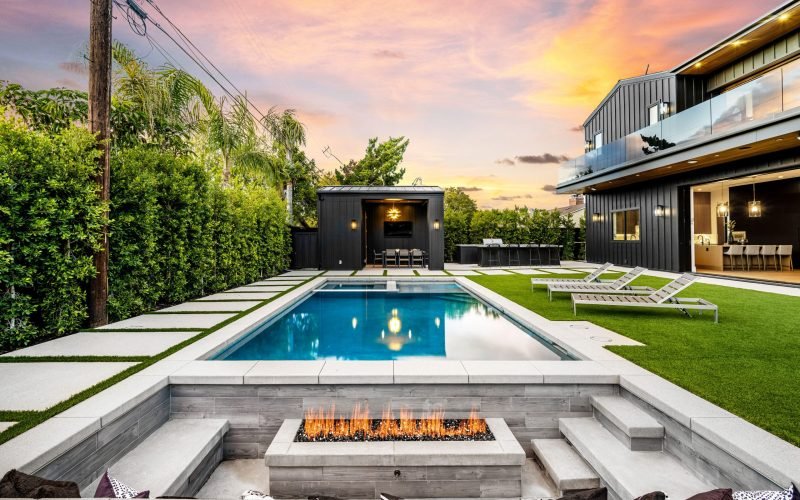 modern-backyard-with-pool-and-fire-pit-at-sunset-2025-02-10-06-40-57-utc-scaled-rirrc82la2907lllr4ux0y38v9c89bb65jjoyutsi0